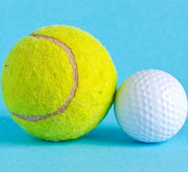a tennis ball and a golf ball