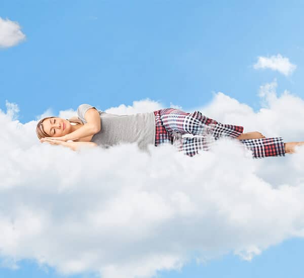 lasy in pyjamas sleeping on cloud 9